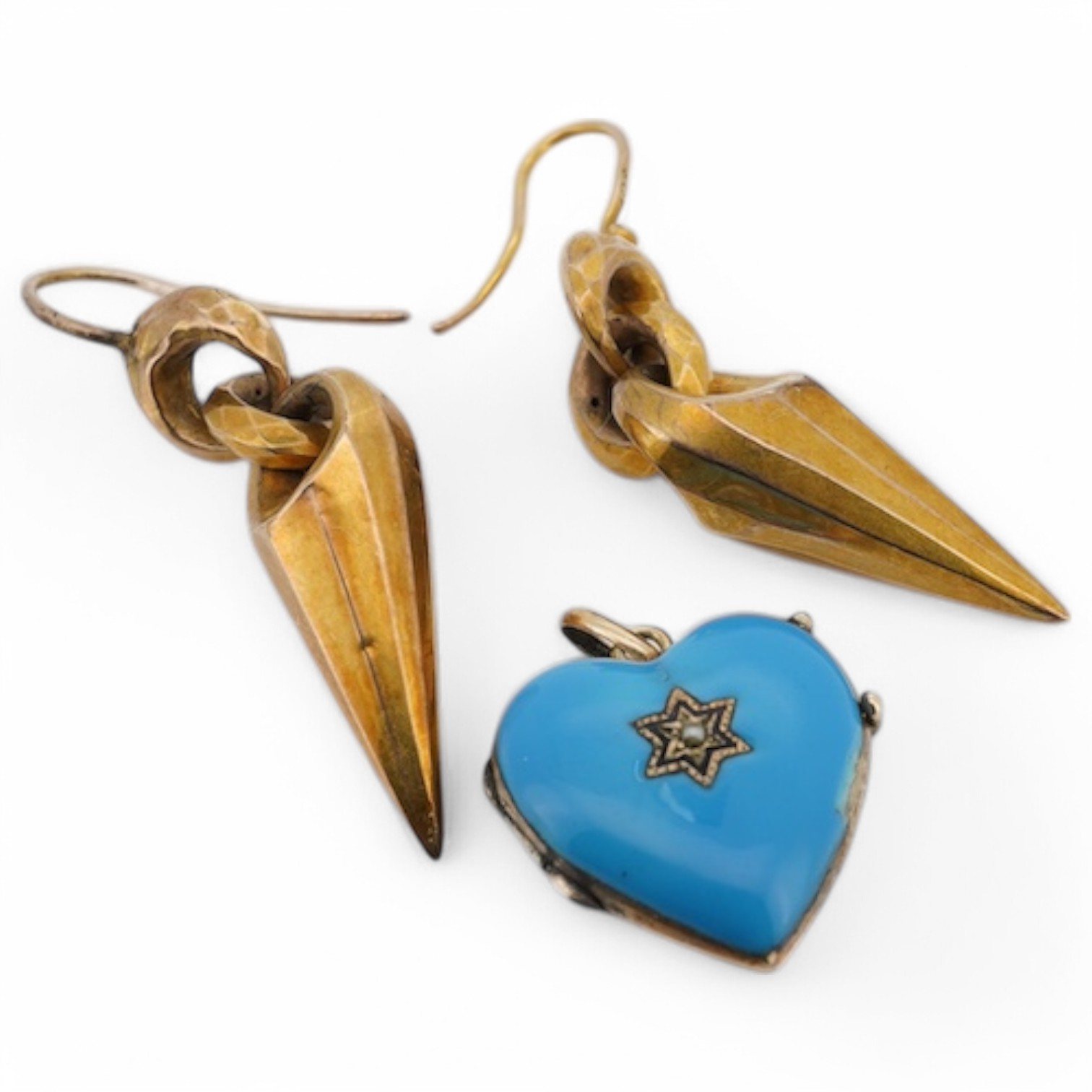 A pair of Victorian yellow metal drop earrings, 32mm excluding ear wire, together with a blue enamel and seed pearl set heart shaped locket(chip). Condition - poor